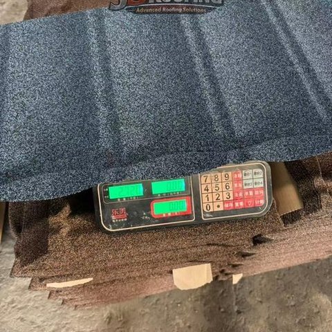 Stone coated roofing sheet installation on residential home